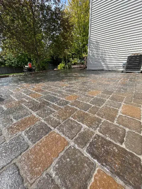 Large paver patio with textured surface in Waconia