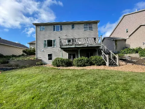 Back view of a house with landscaped yard in Waconia
