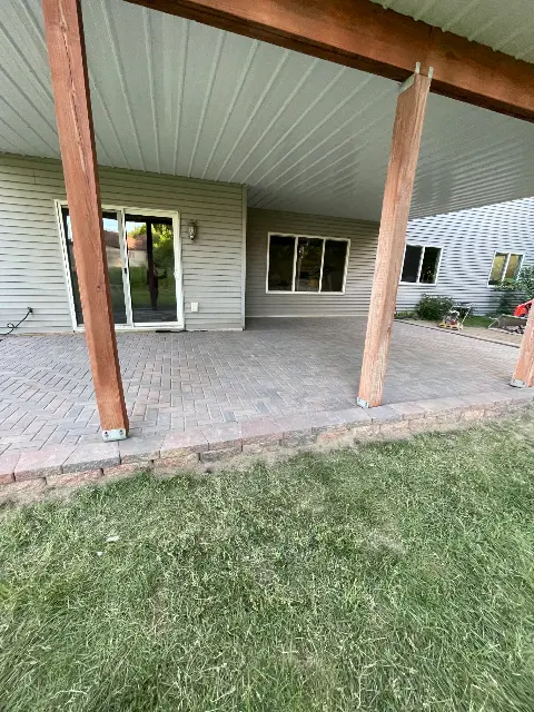 Covered patio area with paver flooring in Waconia
